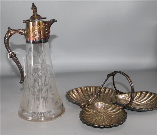 A silver plated claret jug and a silver plated trefoil shell shaped dish.